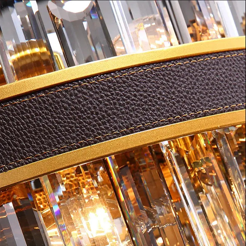 Modern gold crystal leather chandelier with black textured leather band and cascading crystal prisms by decorbites crystal leather