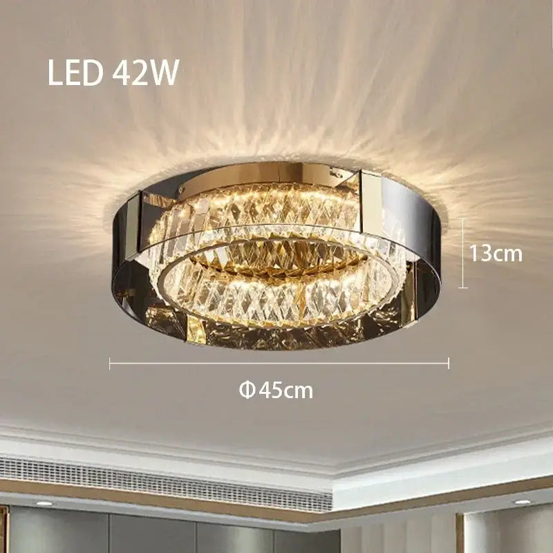 Modern gold crystal led ceiling chandelier with a metal frame and two concentric rings of faceted crystal decorbites crystal led