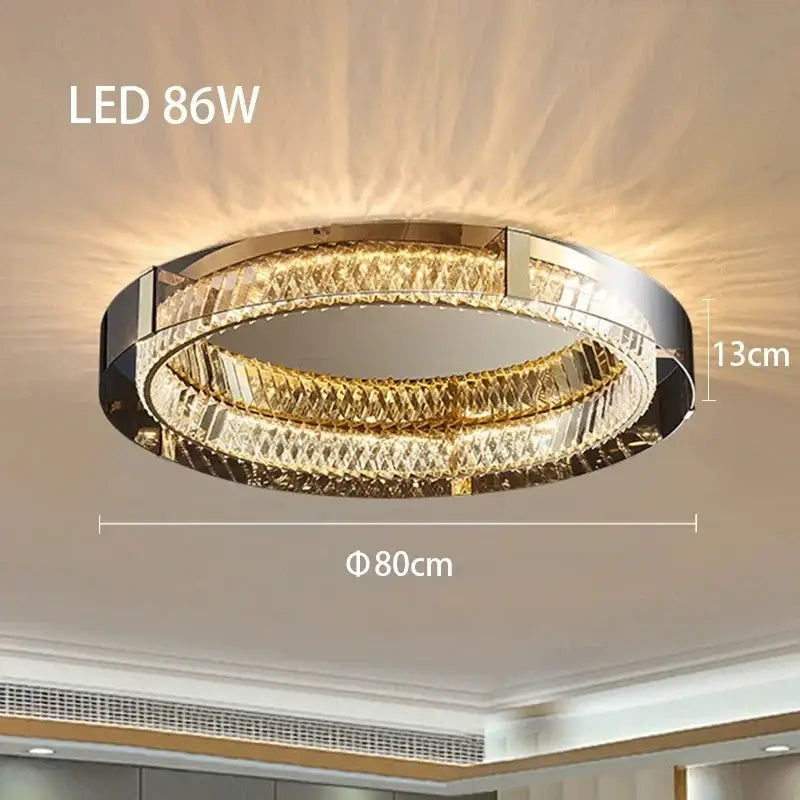 Modern gold crystal led ceiling chandelier with two concentric faceted crystal rings and polished chrome decorbites crystal led