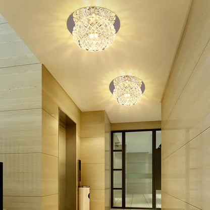 Two modern gold crystal led ceiling chandeliers with intricate faceted designs and warm glowing light decorbites crystal led
