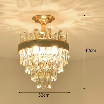 Modern gold crystal led ceiling chandelier with cascading clear glass droplets and circular metallic frame for dining room decorbites crystal led