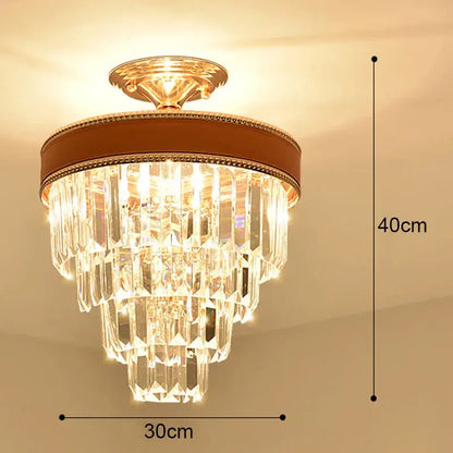 Modern gold crystal led ceiling chandelier with tiered clear prisms and brown leather trim for dining room decorbites crystal led