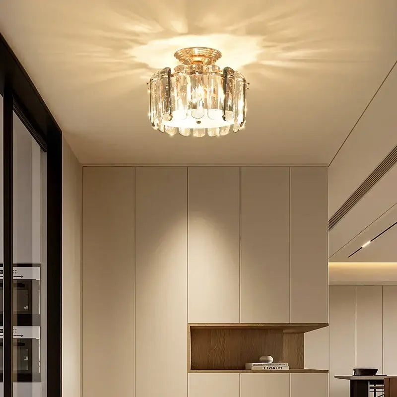 Modern gold crystal led ceiling chandelier with clear faceted glass prisms for dining room by decorbites crystal led