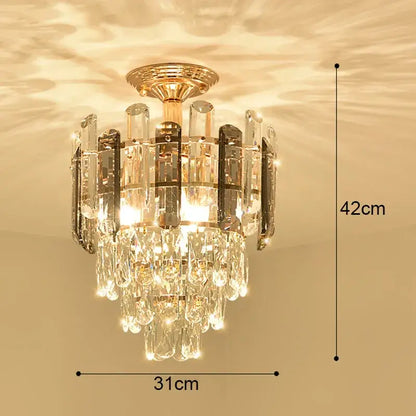 Modern gold crystal led ceiling chandelier with cascading clear crystal droplets and vertical glass panels for dining room decorbites crystal led