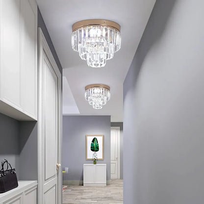 Modern gold crystal led ceiling chandelier with circular frame and cascading clear crystal prisms for dining room
