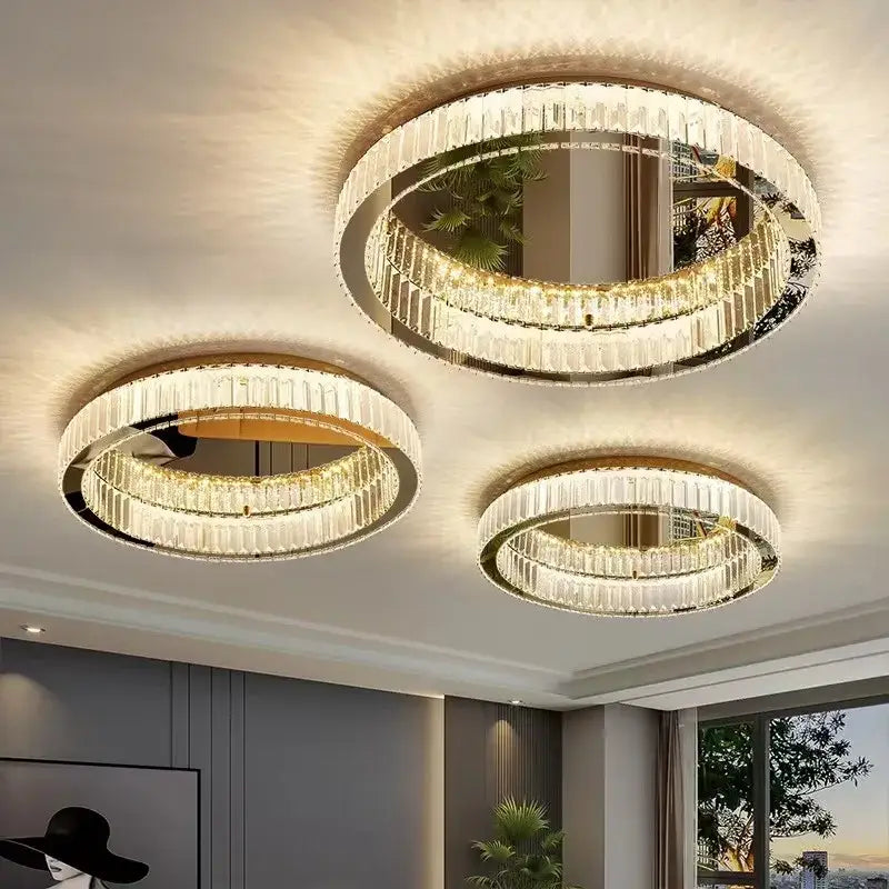 Three elegant gold crystal led ceiling chandeliers with circular frames and cascading faceted glass decorbites crystal led