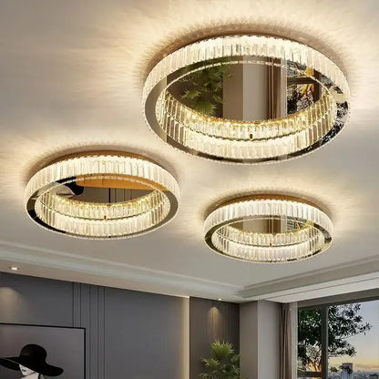 Three elegant gold crystal led ceiling chandeliers with circular frames and cascading faceted glass decorbites crystal led