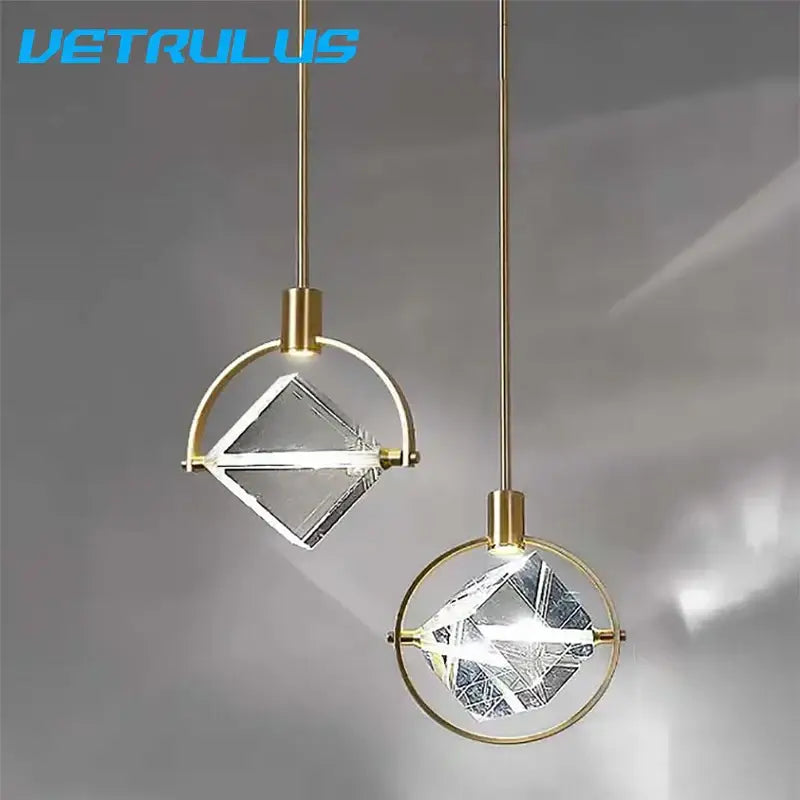 Modern gold crystal led ceiling lamp featuring geometric pendant lights with gold-toned metal and faceted glass elements decorbites crystal led