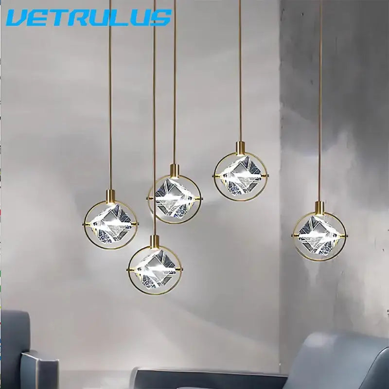 Five modern gold crystal led ceiling pendant lights with faceted clear spheres for dining room decorbites crystal led