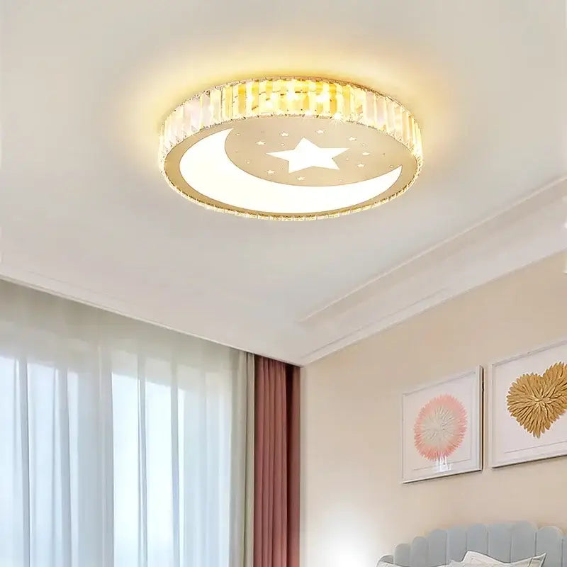 Modern gold crystal led ceiling light with crescent moon star design emitting warm ambient light decorbites crystal led