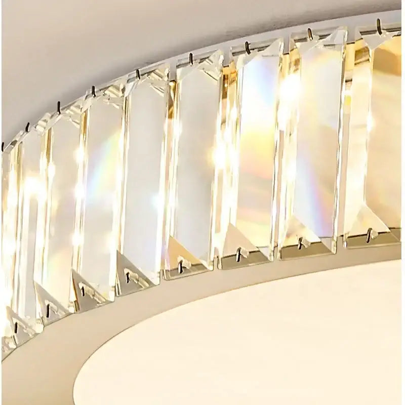Modern gold crystal led ceiling light with curved chrome frame and clear faceted panels by decorbites crystal led