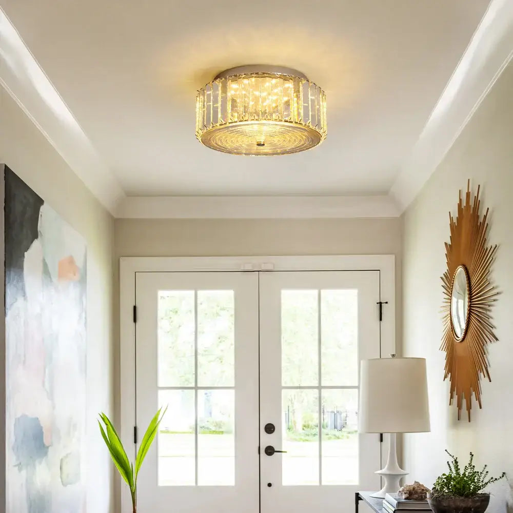Modern gold crystal led ceiling light with a metal frame and faceted crystal led elements for dining room chandelier