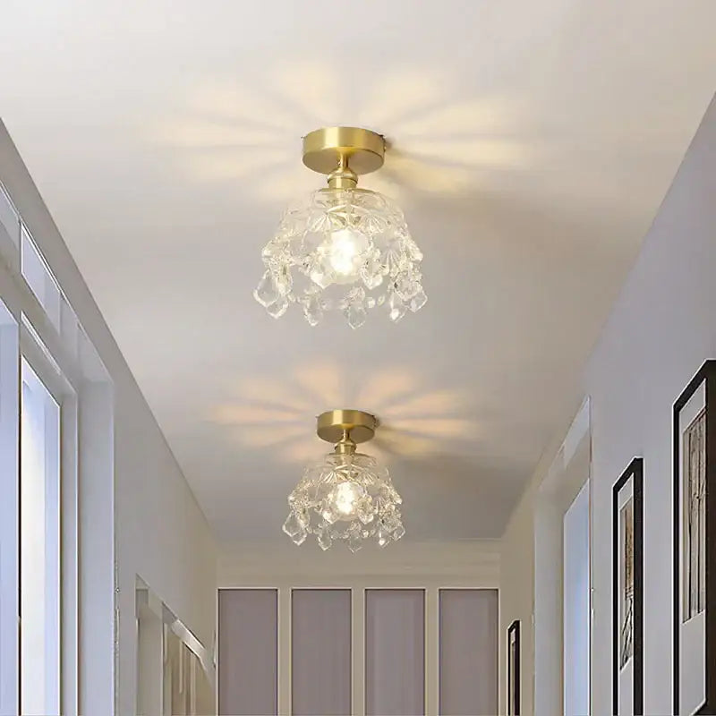 Gold-finished modern chandelier ceiling light with crystal-encrusted glass shade radiating warm illumination decorbites crystal led
