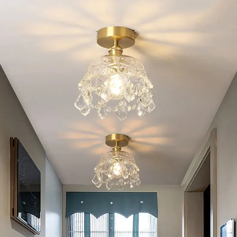 Two elegant modern chandelier ceiling lights with gold-finished bases and intricate crystal led decorbites accents
