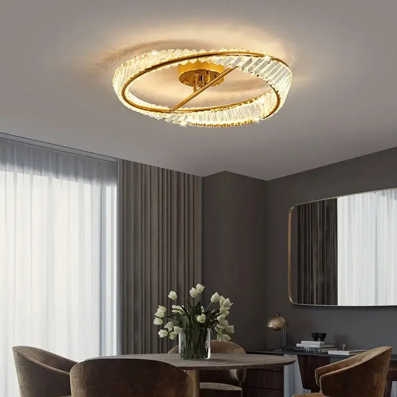 A modern gold crystal led chandelier ceiling light with faceted crystal rings and warm illumination for living room decorbites crystal led