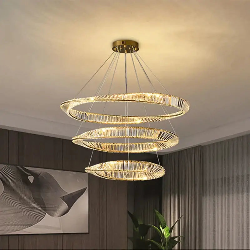 Modern gold crystal led chandelier featuring three concentric faceted crystal rings for elegant dining decorbites crystal led