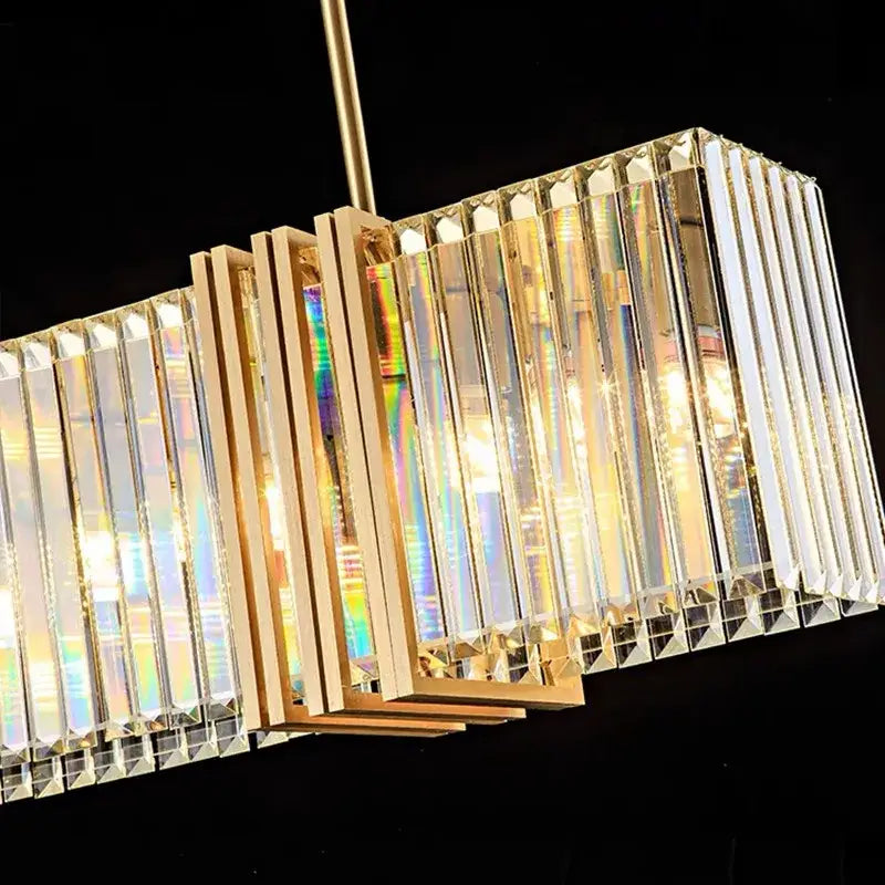 Modern gold crystal led chandelier with vertical crystal prisms refracting rainbow light for dining room decorbites crystal led