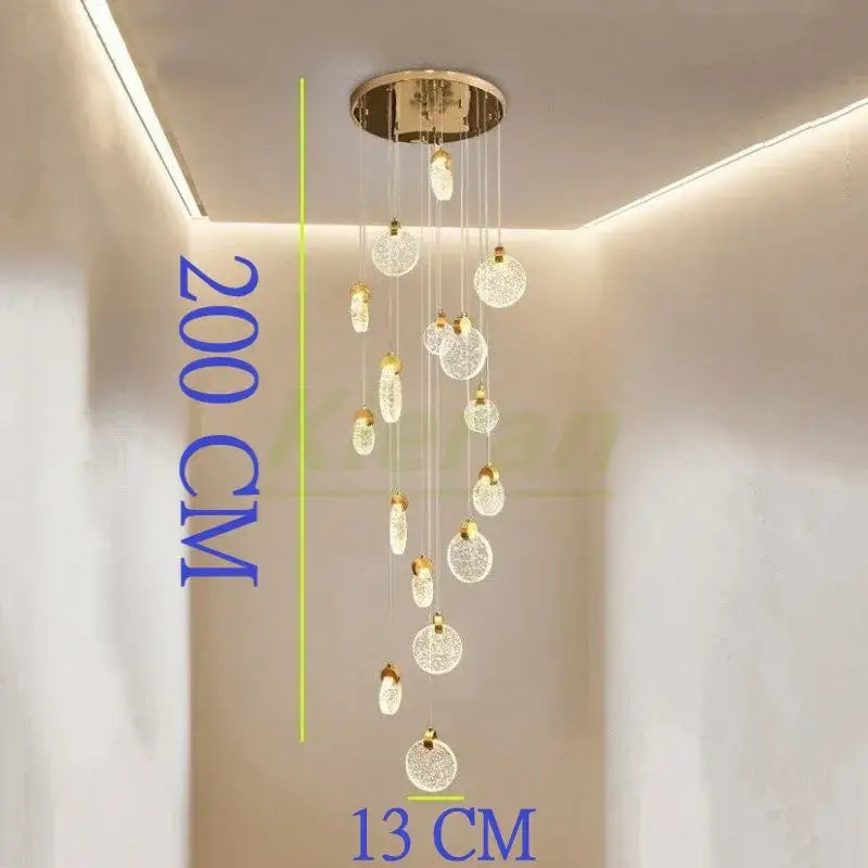 Modern gold crystal led chandelier with a 200 cm gold-toned ceiling mount and lace-patterned crystal spheres decorbites crystal led