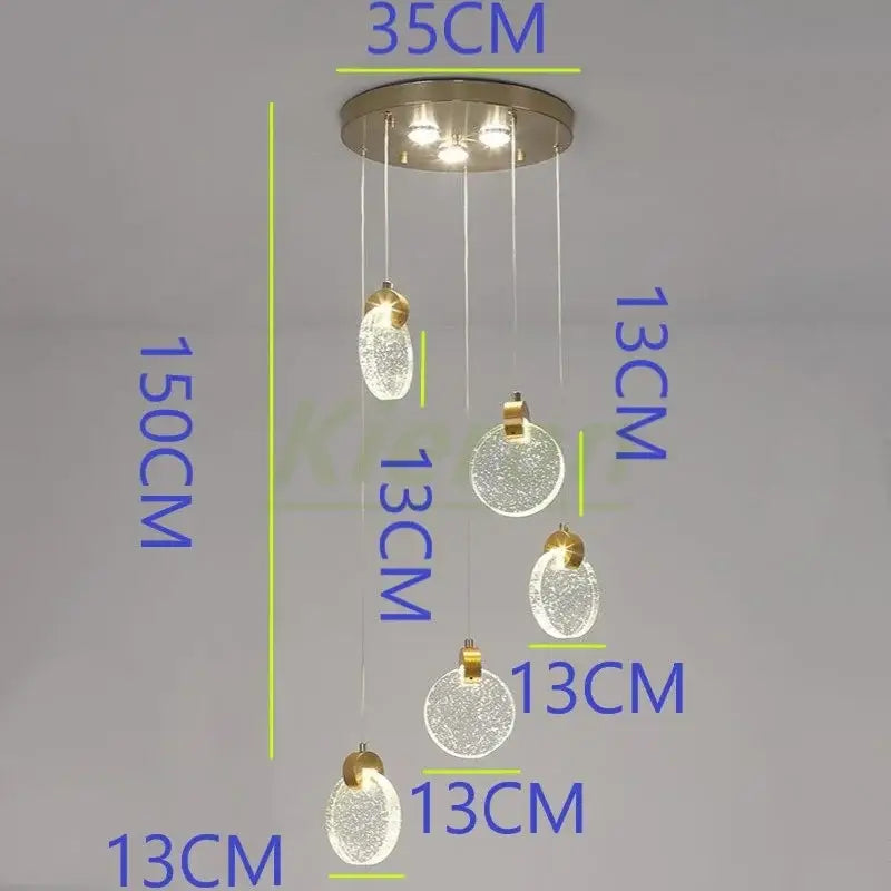 Modern gold crystal led chandelier featuring five frosted glass orbs and brushed metal mount for dining room decorbites crystal led