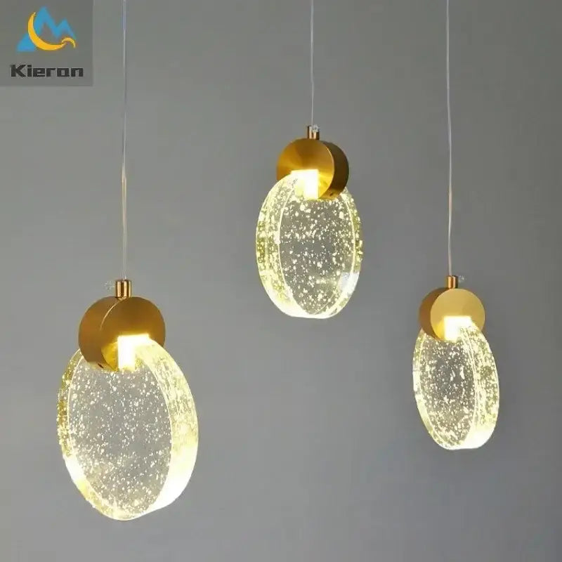 Three modern gold crystal led chandelier pendant lights with bubble-filled glass shades from decorbites crystal led collection