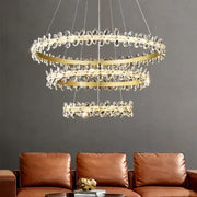 A modern gold crystal led chandelier with three-tiered metal rings and clear crystal droplets for dining room decorbites crystal led