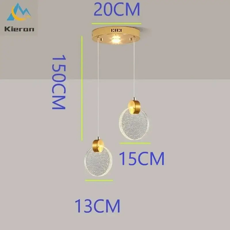 Modern gold crystal led chandelier featuring two textured clear glass orbs suspended by thin cords by decorbites crystal led