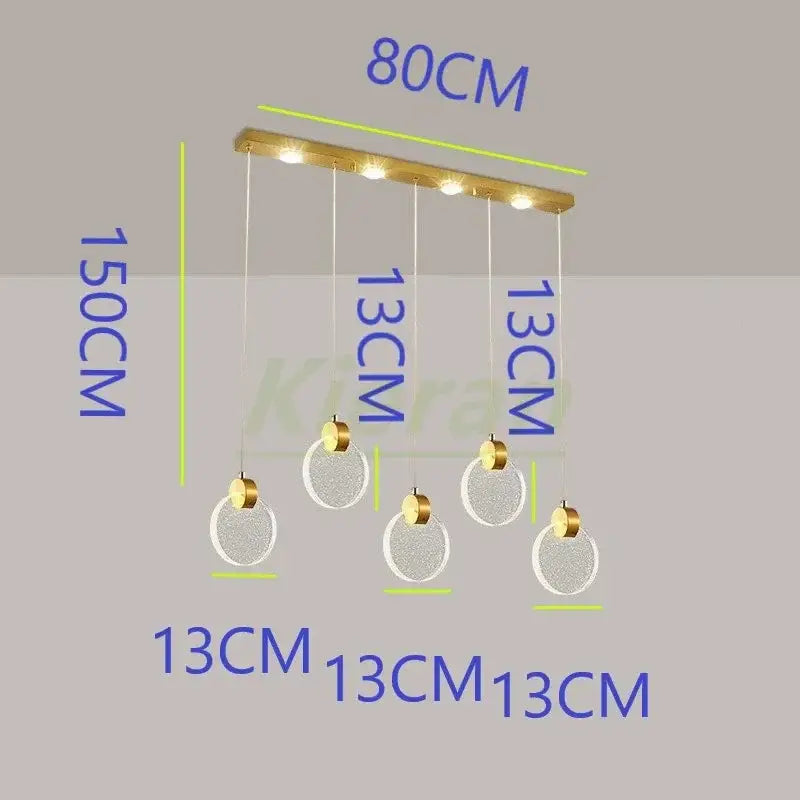 Modern gold crystal led chandelier featuring five clear textured glass orbs suspended from a brass bar by decorbites crystal led