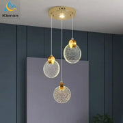Modern gold crystal led chandelier with gold-toned circular pendant lights and textured glass shades for dining room decorbites crystal led