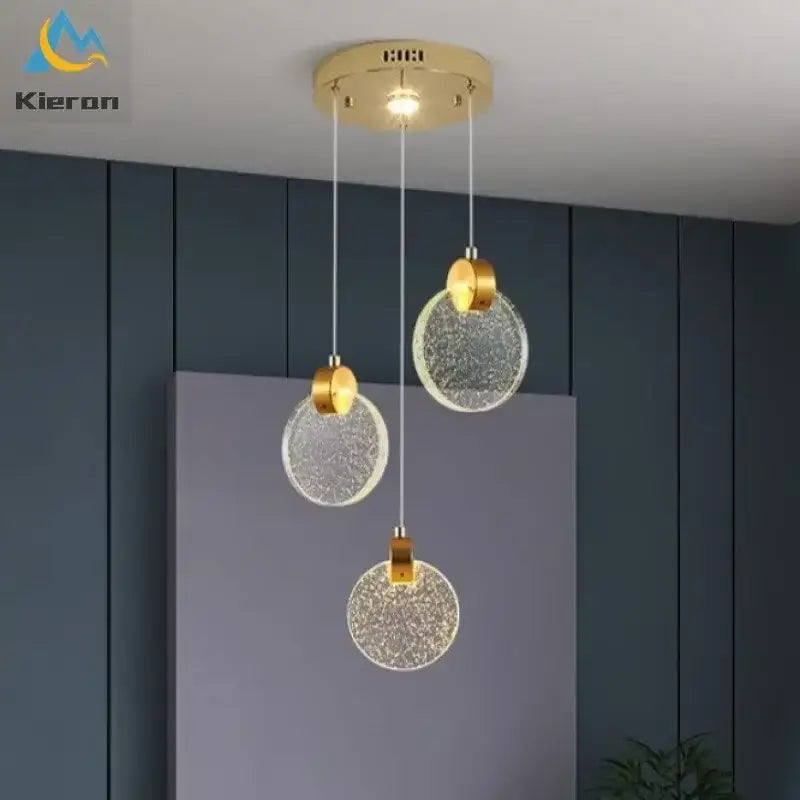 Modern gold crystal led chandelier with gold-toned circular pendant lights and textured glass shades for dining room decorbites crystal led