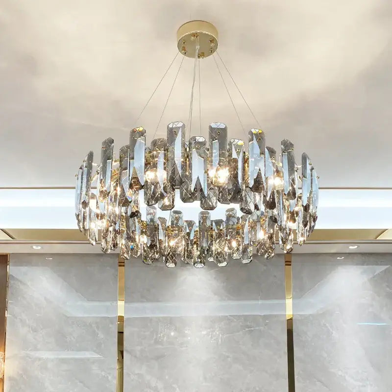 Modern gold crystal led chandelier with faceted clear glass pieces in circular design by decorbites crystal led for living room