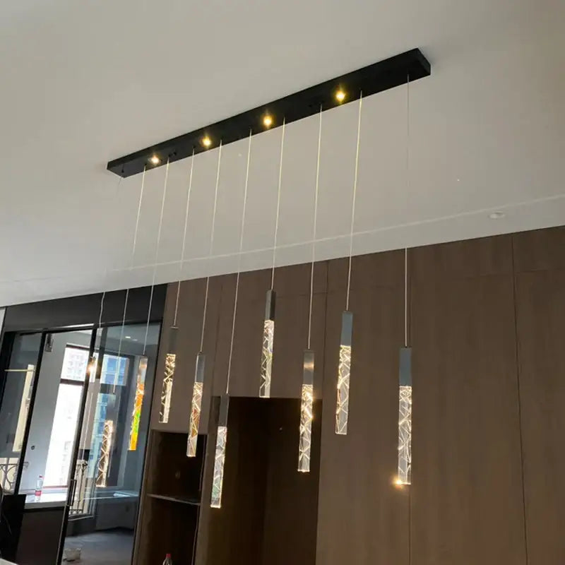 Modern black rectangular ceiling fixture with five glowing cylindrical pendant lights for decorbites crystal led chandelier decor