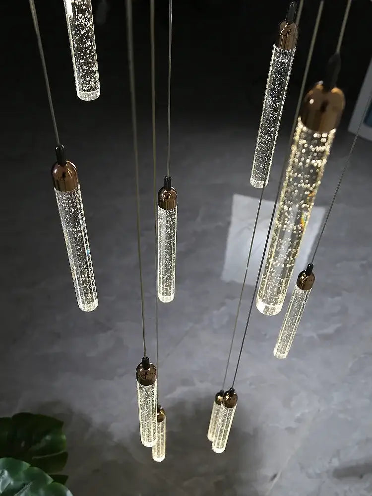 Modern gold crystal led chandelier with multiple cylindrical glass pendants featuring bubble-like decorbites crystal led interior