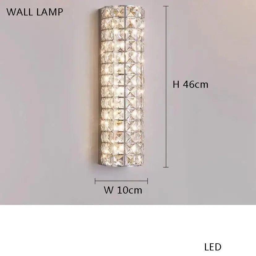 A tall slender modern gold crystal led fan light wall lamp with clear crystal facets for elegant bedroom decorbites crystal led