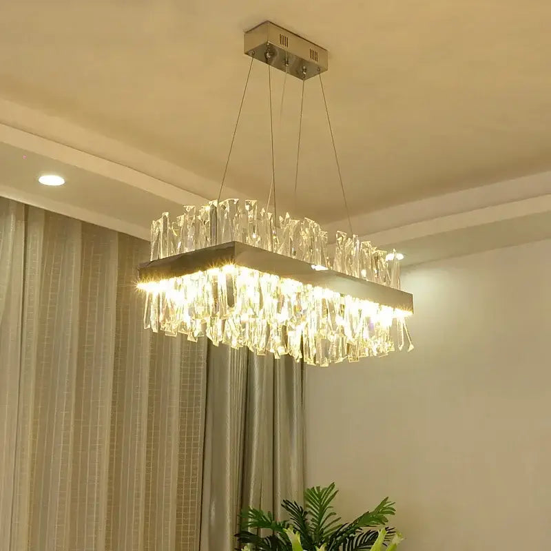 Modern gold crystal led pendant chandelier with sleek metallic frame and cascading clear glass prisms for dining room decorbites crystal led chrome