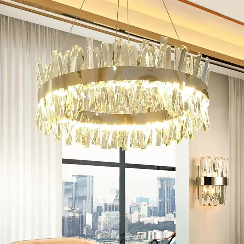 Modern gold crystal led pendant chandelier with a circular metal frame and cascading prisms for dining room decorbites crystal led