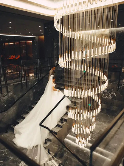 Modern gold crystal led pendant chandelier with cascading tiers of crystal pendants and gold-toned accents for living room decorbites crystal led