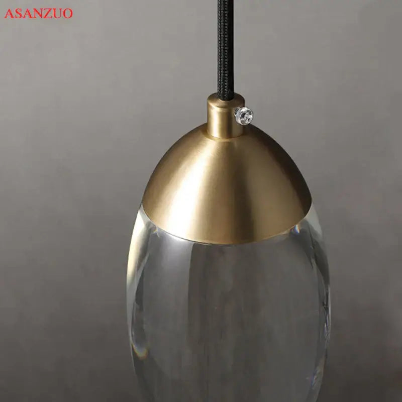 Modern gold crystal led pendant light with polished brass dome top and clear glass body for stylish decorbites crystal led decor