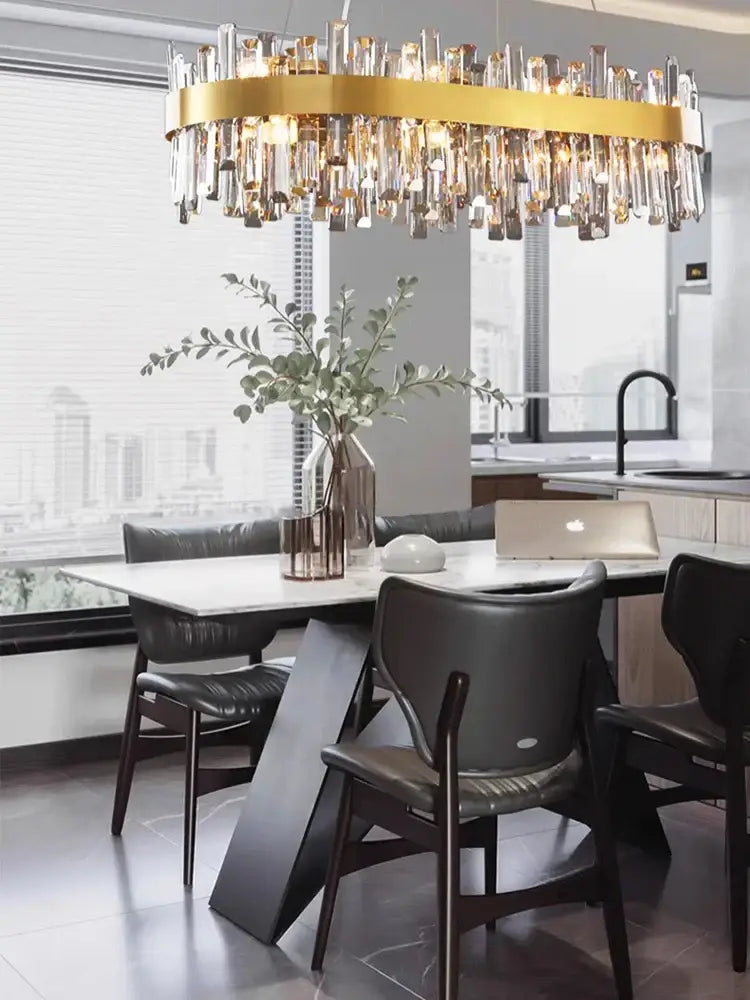 A modern gold crystal led pendant light with circular frame and hanging prisms for dining room decorbites crystal led