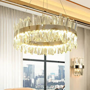 Modern gold crystal led pendant light with a circular metal frame and cascading clear crystals by decorbites pendant light