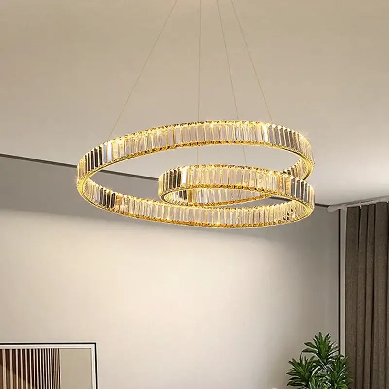 Modern gold-toned double-ring crystal led pendant light with faceted accents for dining room decorbites crystal led