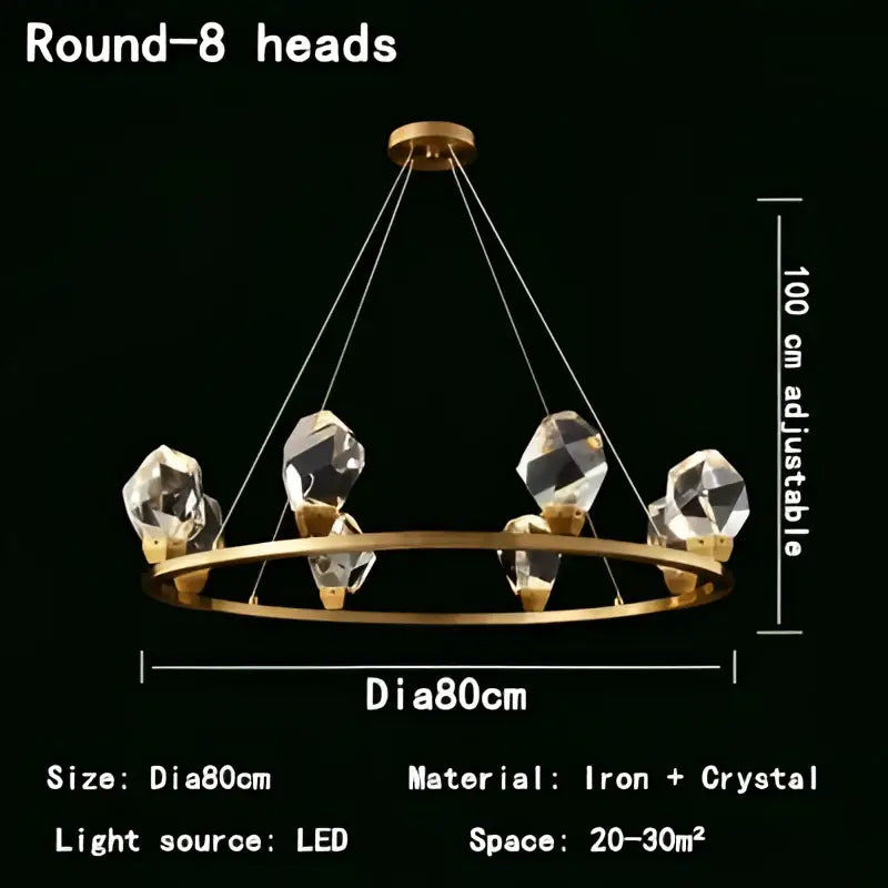 Modern gold crystal led pendant lights featuring a gold-toned circular chandelier with eight faceted crystal led pendant lights suspended by wires