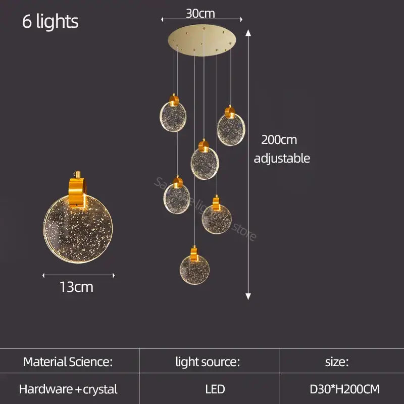 A modern gold crystal led stair slinglight pendant light with six spherical glass orbs and decorbites crystal led interiors