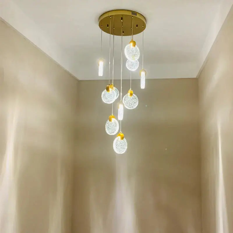 Modern gold crystal led stair slinglight featuring gold-toned metal and clear textured glass spheres for living room decorbites crystal led