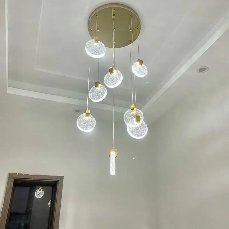 Modern gold crystal led stair slinglight features multiple glass orbs and an elongated pendant for living room decorbites crystal led