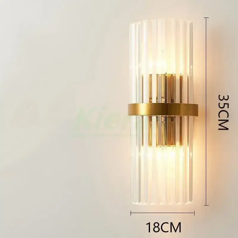 Modern gold crystal led wall lamp with vertical clear glass rods and central brass band for bedroom decorbites crystal led