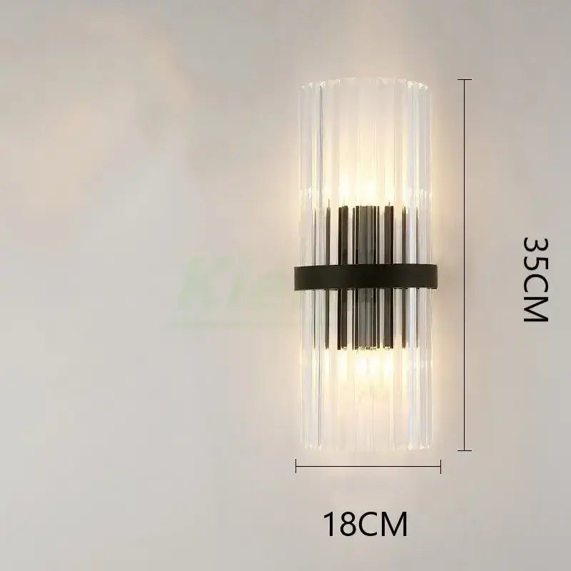 Modern gold crystal led wall lamp with vertical clear glass rods and black metal band emitting warm light for decorbites crystal led wall decor