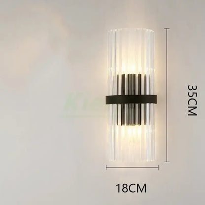 Modern gold crystal led wall lamp with vertical clear glass rods and black metal band emitting warm light for decorbites crystal led wall decor