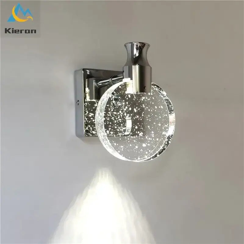 Modern gold crystal led wall lamp featuring chrome finish and clear glass globe with embedded sparkling particles decorbites crystal led
