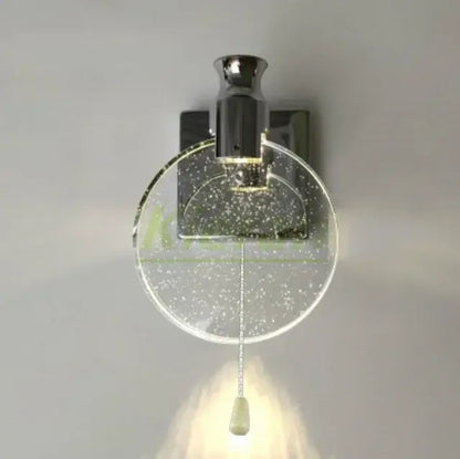 Modern chrome-finished wall lamp with circular glass diffuser embedded with glitter and elegant pull chain switch decorbites crystal led wall