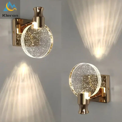Modern gold-toned wall lamp with a crystal led glass globe filled with sparkling particles for elegant bedroom decorbites crystal led wall
